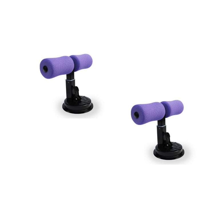 Pair of purple dumbbells with suction cups on a white background