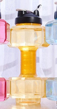Colorful bottles with black caps on a white background