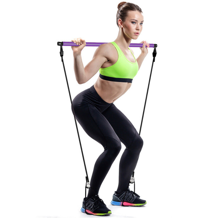 Woman exercising with resistance bands on a white background