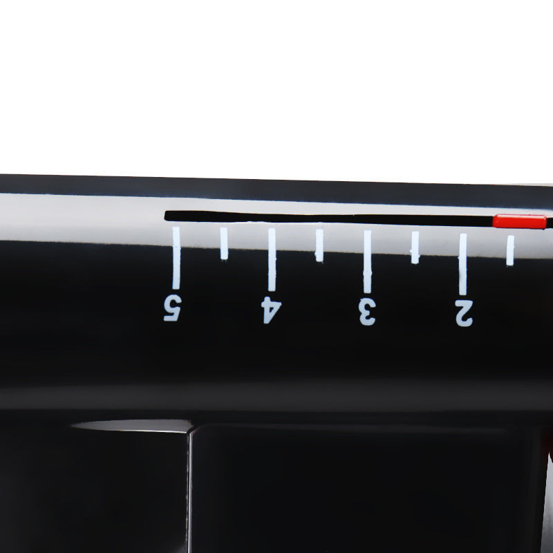 Black ruler with measurement markings on a white background