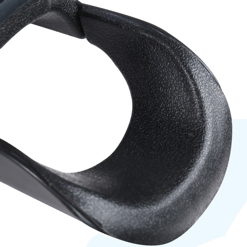 Close-up of a black carabiner on a white background