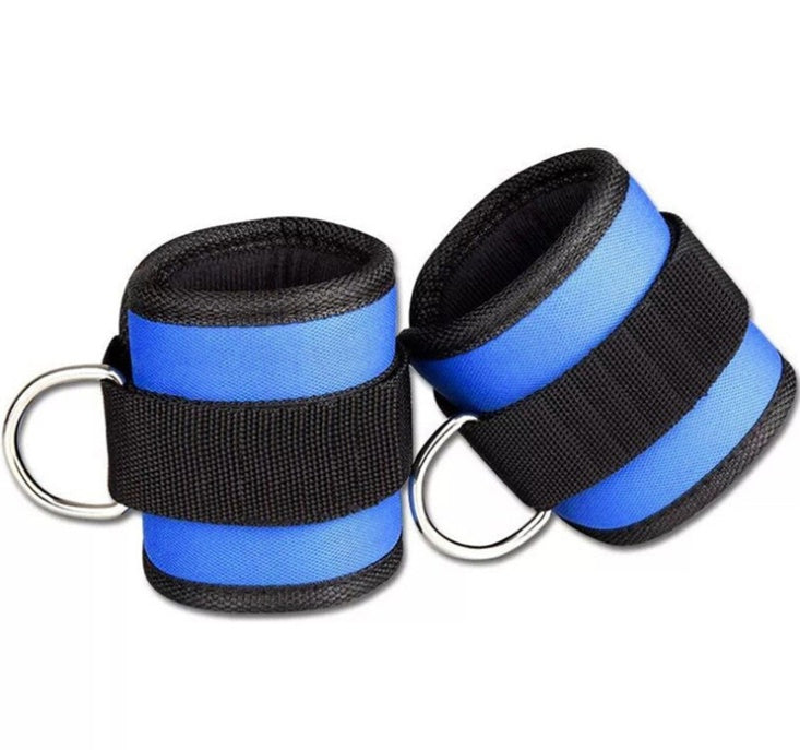Pair of blue and black wrist straps with metal rings on a white background