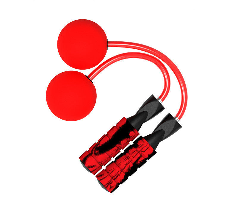 Red jump rope with black handles on a white background