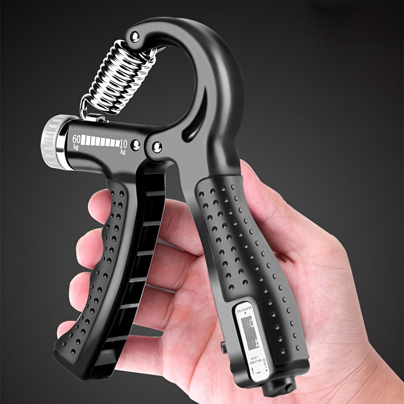 Hand grip trainer with digital display held in a hand against a dark background